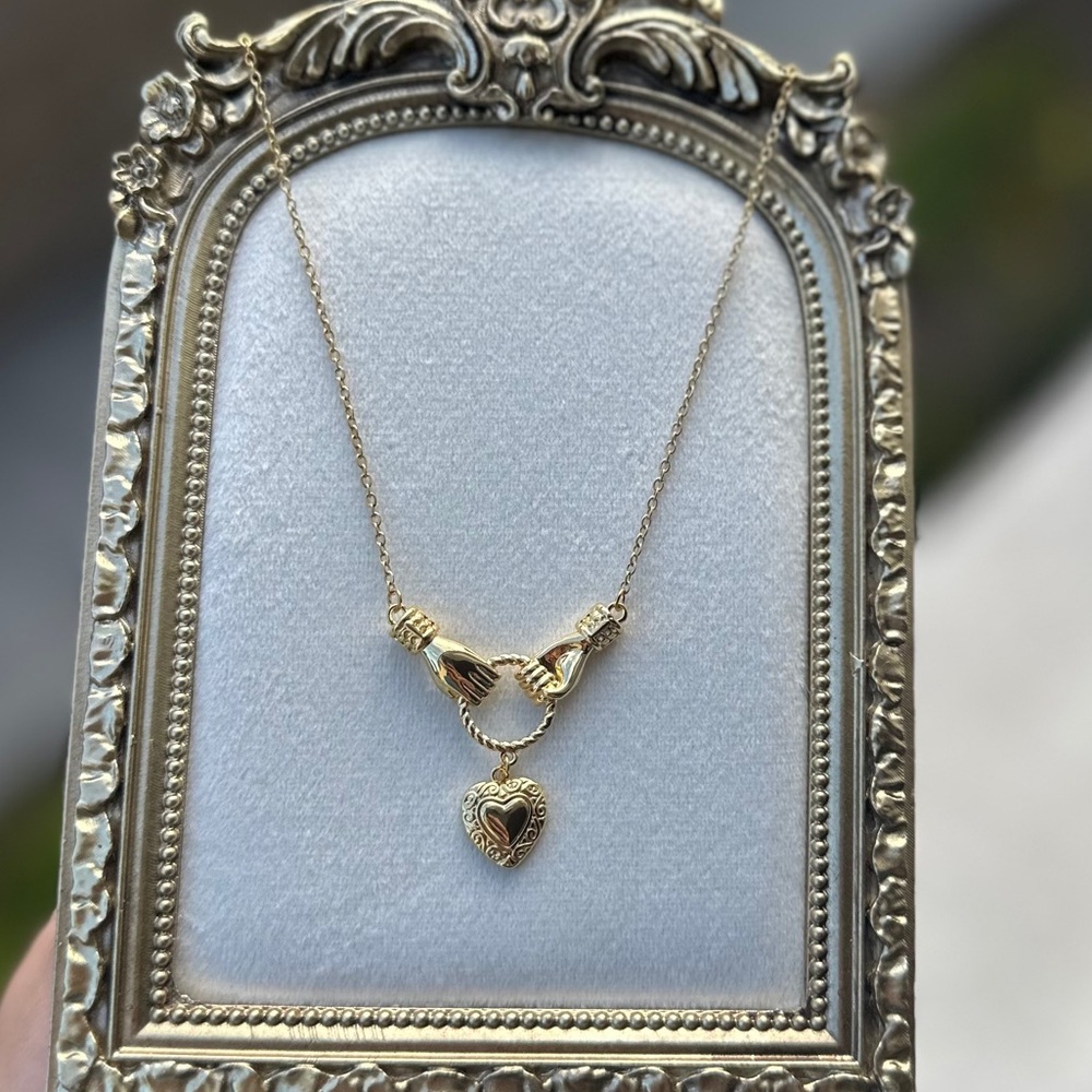 Symbolic Love Necklace – Hands Holding Heart Pendant, 18K Gold Plated - Picture 3 of 4